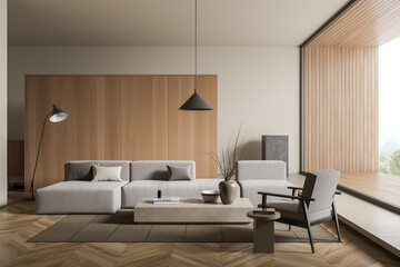 Bright living room interior with sofa and armchair, panoramic window