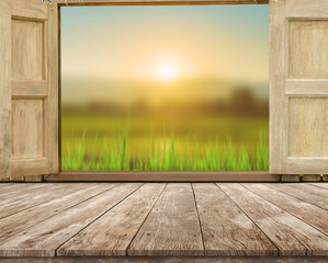 old brown wooden board empty table and wooden table top with blured paddy field in morning background Product display advertisement mock up background