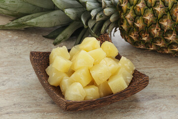 Marinated pineapple slices in the bowl