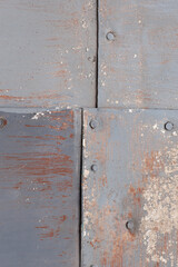 Background surface texture of old rusty metal sheets fastened with nails looks like aged building cladding. High quality photo. Place your text