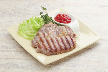 Grilled pork neck steak with ketchup