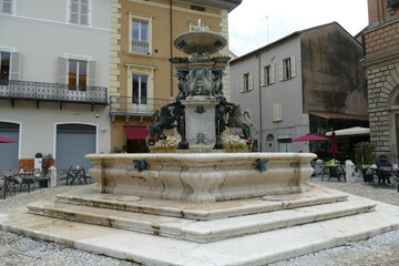 Obraz premium the monumental fountain in Faenza, designed by Paganelli with bronze statues