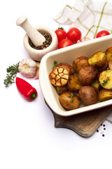 Baked potato in baking dish pot isolated on white background