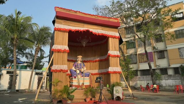 Howrah, West Bengal, India - 5th February 2022 : Idol of Goddess Saraswati being worshipped inside pandal. Saraswati is Hindu goddess of knowledge, music, art, wisdom, and learning.