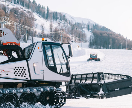 Sochi, Estosadok, Russia, 31 March 2021: Close-up of a Caterpillar Snow Cat 'Prinoth' in the background Ski slope.