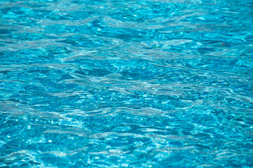 Water in swimming pool, background with high resolution. Wave abstract or rippled water texture.