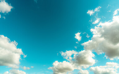 White fluffy clouds on blue sky. Soft touch feeling like cotton. White puffy cloudscape. Beauty in...