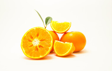 Group of oranges and leaves. Fresh-looking yellow fruit isolated on a white background. Fruits with vitamins and good health focus on specific points. Advertising concept and healthy, space for text