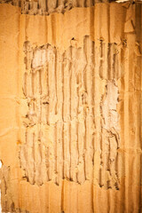 Brown cardboard torn crumpled.