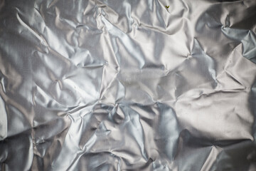 Crumpled aluminum foil background.