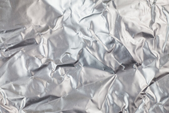 Crumpled aluminum foil background.