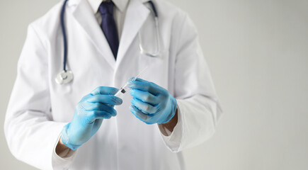 Professional medical doctor in hospital office. Portrait of young and confident physician. Medical...