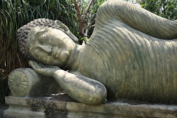 statue of buddha in the garden, nirvana Buddha