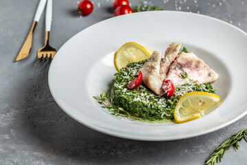 Pike perch fillet with mussels, peas, asparagus and vegetable cream sauce. Fried fish with stewed greens. Restaurant menu, dieting, cookbook recipe