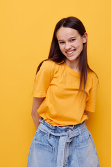 young woman in a yellow t-shirt emotions summer style isolated background