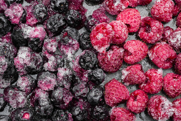 Berries. Frozen fruit background. Blueberry and raspberry.