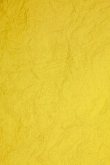Crumpled vintage yellow paper textured obsolete background.