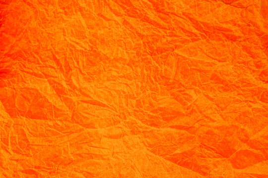 Crumpled vintage Orange paper textured obsolete background. © peterkai