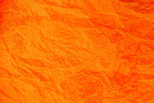 Crumpled vintage Orange paper textured obsolete background. © peterkai