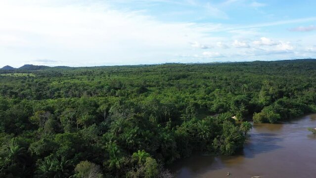 Aerial Sewa River jungle forest central Sierra Leone Africa . West Africa suffers extreme poverty and hunger. Forest jungle landscape environment. Congested crowded homes tropical climate.