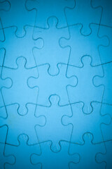 Fototapeta premium Blue Jigsaw puzzle background.