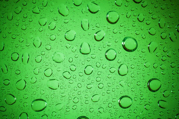 Plakat water drops on glass background.