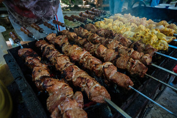 holiday barbecue. different meats on the grill.