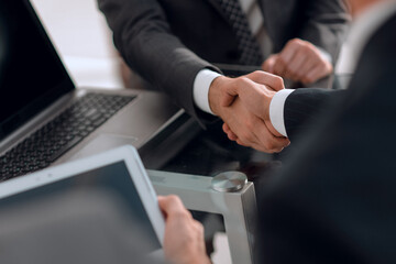 confident handshake of business partners