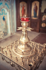 Fototapeta na wymiar red candlestick in an orthodox church