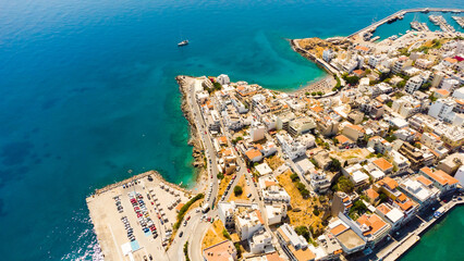 Naklejka premium Agios Nikolaos. Agios Nikolaos is a picturesque town in the eastern part of the island Crete built on the northwest side of the peaceful bay of Mirabello.