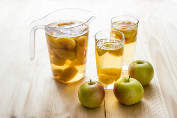 Compote of apples in glass cups and in a jug.