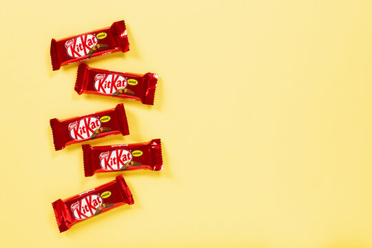 Kit Kat Mini chocolate candies on yellow background	
