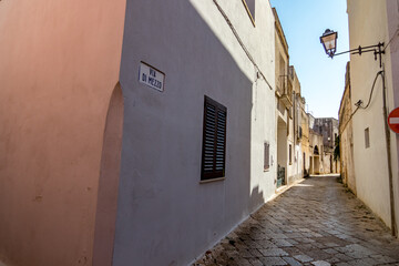 Empty narrow road. Alessano, region of Lecce, Italy. Lovely summer day. Travel street view.