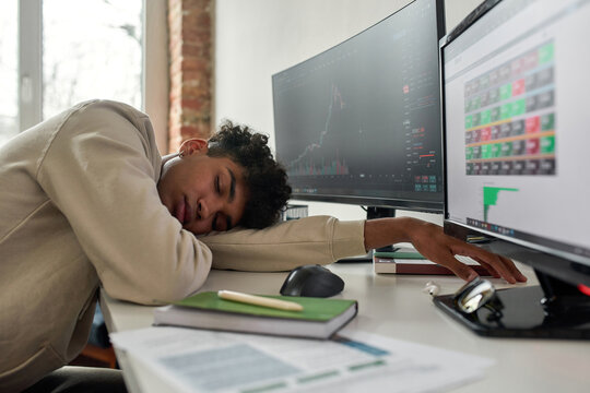 Tired african american male trader fall asleep off at workplace