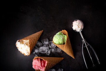 ice cream in waffle cones, dark background
