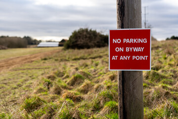 'No parking on byway at any point' sign in the countryside