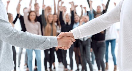 young business people shaking hands with each other