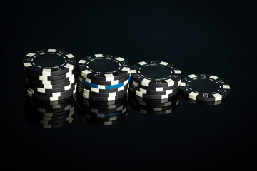 Black chips received as a result of winning. Successful combination in the casino. Luck or fortune in a poker club