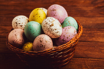 Hand painted pastel colored Easter eggs background. Happy Easter greeting card or invitation.