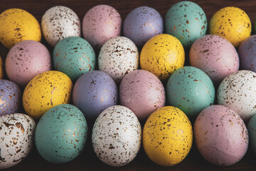 Hand painted pastel colored Easter eggs background. Happy Easter greeting card or invitation.