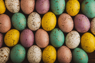 Hand painted pastel colored Easter eggs background. Happy Easter greeting card or invitation.