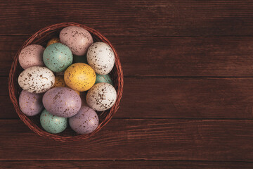 Hand painted pastel colored Easter eggs background. Happy Easter greeting card or invitation.