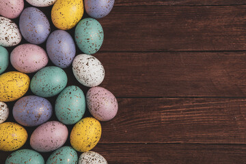 Hand painted pastel colored Easter eggs background. Happy Easter greeting card or invitation.