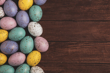 Hand painted pastel colored Easter eggs background. Happy Easter greeting card or invitation.