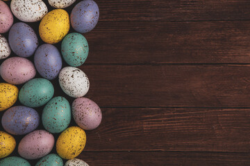 Hand painted pastel colored Easter eggs background. Happy Easter greeting card or invitation.