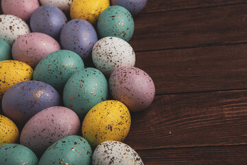 Hand painted pastel colored Easter eggs background. Happy Easter greeting card or invitation.