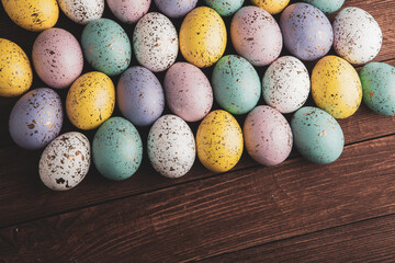 Hand painted pastel colored Easter eggs background. Happy Easter greeting card or invitation.