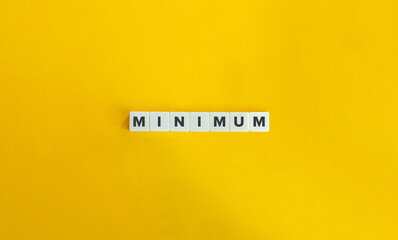 Minimum Word on Letter tiles on bright orange background. Minimal aesthetics. - obrazy, fototapety, plakaty