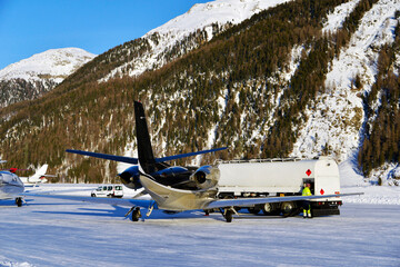 A private jet filling its oil tank in the airport of St Moritz