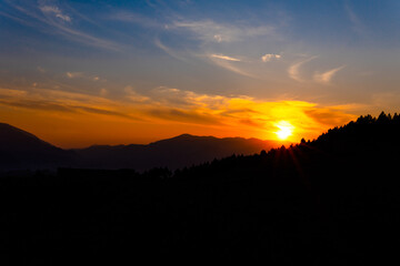 dark and moody dramatic sunset sky mountains silhouette